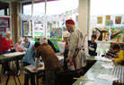 Behind them the cives are decorating their future clothing.